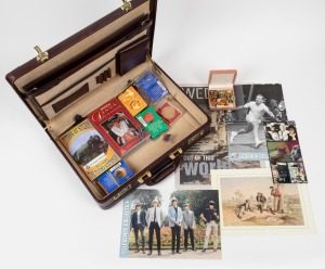 A good quality briefcase containing a variety of modern collectables including badges, collector cards, videos, etc.