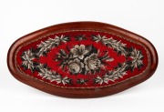 An antique Colonial Australian cedar footrest with brass bun feet and attractive floral beadwork tapestry top, mid 19th century, 58cm wide