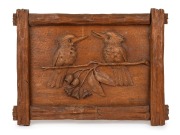 RUDOLF PRENZEL carved eucalypt plaque with two kookaburras, gumnuts, blossoms and leaves, early to mid 20th century, signed lower right "Rudolf Prenzel, Melbourne", ​​​​​​​32 x 43cm overall.