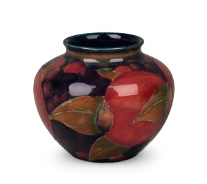 MOORCROFT "Pomegranate" squat vase on blue ground, impressed "Moorcroft, Burslem", ​​​​​​​6.5cm high, 8cm wide.