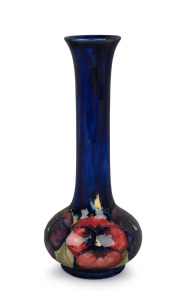 MOORCROFT "Pansy" pattern pottery stem vase on blue ground, impressed mark to base, with paper label, 21cm high.