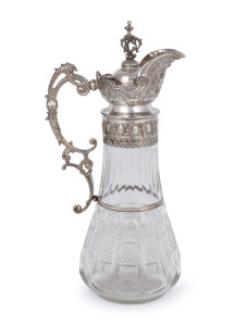 An antique cut crystal claret jug with ornate Continental silver mounts, 19th century, 35cm high.