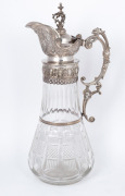 An antique cut crystal claret jug with ornate Continental silver mounts, 19th century, 35cm high. - 2