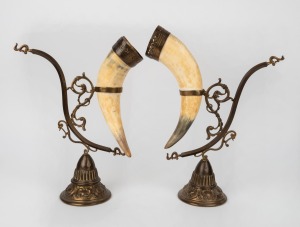 A pair of cast brass and horn mantle ornaments, 20th century, 45cm high.