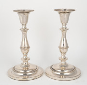 A pair of vintage silver plated candlesticks with weighted bases, 20th century, 24cm high.