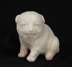 An antique Japanese bisque blanc de chine porcelain dog statue, Meiji Period, 19th century, 9.5cm high.