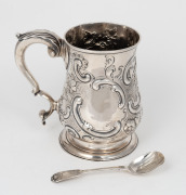 A Georgian sterling silver tankard with repousse decoration, made in London, circa 1779; together with a Georgian sterling silver spoon, (2 items), ​​​​​​​the tankard 15cm high, 580 grams total.