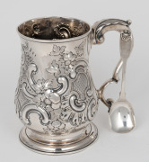 A Georgian sterling silver tankard with repousse decoration, made in London, circa 1779; together with a Georgian sterling silver spoon, (2 items), ​​​​​​​the tankard 15cm high, 580 grams total. - 2
