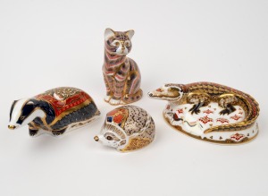ROYAL CROWN DERBY crocodile, cat, hedgehog and badger statues, all with gold button marks, ​​​​​​​the cat 12.5cm high.