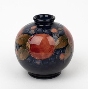 MOORCROFT "Pomegranate" spherical vase on blue ground, impressed "Moorcroft, Made In England, Potters To H.M. The Queen", with remains of paper label, ​​​​​​​10.5cm high.
