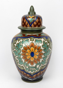 GOUDA antique Dutch pottery lidded vase on green ground, early 20th century, factory mark to base, 34cm high.