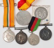 A group, including two 1914-18 British War Medals, a 1941-5 Burma Star, a 1939 German medal, various English County military hat badges, a 1964 Malawi Independence medal, a Rhodesia 1965 Independence silver medal, etc. (Total: 17 items). - 3
