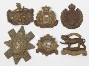 A group, including two 1914-18 British War Medals, a 1941-5 Burma Star, a 1939 German medal, various English County military hat badges, a 1964 Malawi Independence medal, a Rhodesia 1965 Independence silver medal, etc. (Total: 17 items). - 4