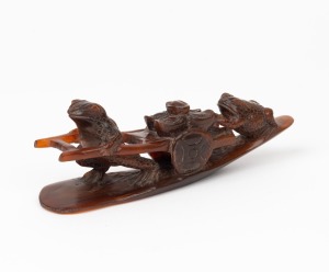 A Chinese carved horn toad ornament, 20th century, ​​​​​​​14cm long.