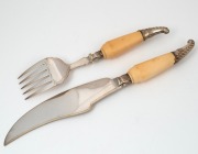 A pair of antique English silver plated fish servers with engraved decoration and ivory handles, 19th century, the larger 33cm long. - 2