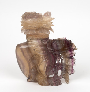 A Chinese carved rock crystal lidded vase with peony decoration, 19th/20th century, ​​​​​​​17.5cm high.