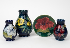 MOORCROFT pottery "Hibiscus" dish on green ground, together with three assorted baluster shaped floral vases, (4 items), ​​​​​​​the largest 13.5cm high.