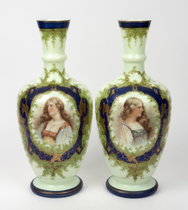 A pair of antique green milk glass mantle vases with portrait vignettes, 19th century, 36cm high.