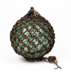 A vintage glass fishing buoy with rope bindings, 20th century, 35cm high overall.