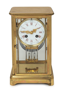 An antique French four glass library clock in polished brass case with mercury compensated pendulum, enamel dial and Roman numerals, circa 1900, 26cm high.