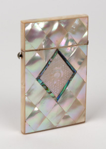 An antique calling card case, mother of pearl and abalone shell, 19th century, housing original calling cards for Mr A. G. Carter, ​​​​​​​9cm high.