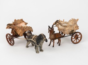 Cold painted spelter dog and deer carts, mounted with seashells, 20th century, (2 items), 13cm and 11cm long.
