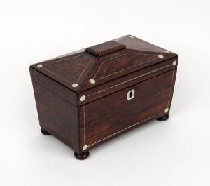 An antique English rosewood and mother of pearl tea caddy, interior fitted with two lidded compartments, circa 1830, 16cm high, 23.5cm wide, 13.5cm deep.