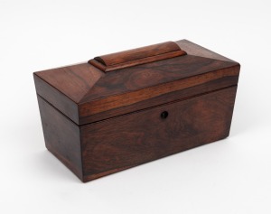 An antique English rosewood tea caddy, interior fitted with two lidded compartments and mixing bowl, circa 1840, 16cm high, 30cm wide, 15.5cm deep.