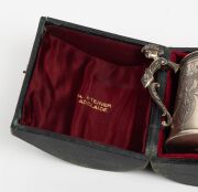 HENRY STEINER antique Australian sterling silver christening mug with engraved decoration and figural handle, housed in original plush fitted box with Henry Steiner branding, 19th century, stamped "H. STEINER" with lion passant and monarch's head, 10cm hi - 4