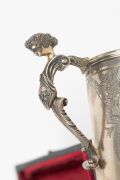 HENRY STEINER antique Australian sterling silver christening mug with engraved decoration and figural handle, housed in original plush fitted box with Henry Steiner branding, 19th century, stamped "H. STEINER" with lion passant and monarch's head, 10cm hi - 6