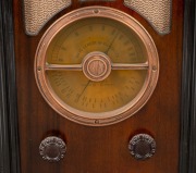 AIRZONE walnut veneer case tombstone mantle radio with copper bezel, 41.5cm high. - 2