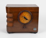 AIRKING walnut veneered mantle radio with blue enamel button advertising, ​​​​​​​25cm high. - 2