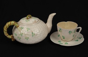 BELLEEK Irish porcelain teapot, teacup and saucer with shamrock decoration, (3 items), green factory marks to the bases, ​​​​​​the teapot 10cm high, 20cm wide.