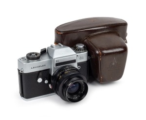 LEITZ: Leicaflex SL SLR camera [#1258355], c. 1968, with Elmarit-R 35mm f2.8 lens [#2410513], Leitz 14160 VI adapter ring, and Leitz leather case.