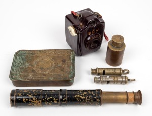 WWI Christmas 1914 tin, pocket telescope with remains of blackout finish, brass canister and two antique military/police whistles; together with a vintage "BOY" bakelite camera, mixed condition and vintage, (6 items), ​​​​​​​the tin 13cm wide.