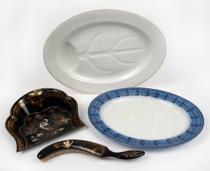 An antique porcelain roasting platter, blue and white meat platter, and an antique papier-m&acirc;ch&eacute; crumb tray and brush with hand-painted decoration, 19th/20th century, (3 items), the largest 48cm wide