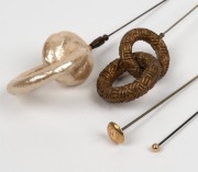 HATPINS, four vintage examples including two with gold tops, 19th/20th century, ​​​​​​​the largest 17cm long. - 2
