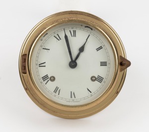 A vintage German bulkhead clock with twin train spring driven movement, 20th century, 15cm diameter overall.