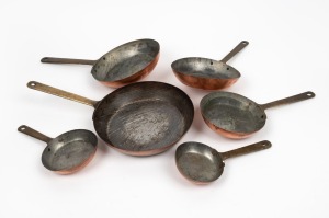 A graduated set of five vintage French copper frying pans, the largest 20cm diameter.
