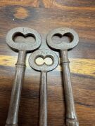 Four convict prison cell door keys with broad arrow marks, 19th century, each approximately ​​​​​​​11cm long. - 2