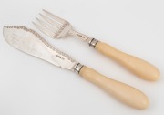 A pair of antique English sterling silver fish servers with handsome ivory handles, 29cm long.
