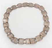 A Chinese export silver belt adorned with Chinese characters, 19th/20th century, stamped "Silver, H. K.", 89cm long, 130 grams.