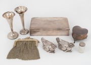A sterling silver mesh purse (110 grams), together with a pair of silver hen ornaments (82 grams), a sterling silver cigarette box with cedar lining (350 grams including lining), a sterling silver heart shaped box (42 grams including lining), two silver s
