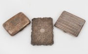 An antique sterling silver calling card case, together with two sterling silver cigarette cases, 19th/20th century, (3 items), the calling card case 10cm high, 227 grams total.