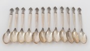 GEORG JENSEN set of eleven Danish sterling silver "Acanthus" pattern teaspoons, 20th century, 11.5cm, 157 grams.
