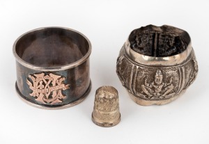 A Burmese silver napkin ring, a silver thimble and an attractive Australian silver napkin ring with rose gold monogram, (3 items).