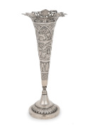 A Burmese silver trumpet shaped vase with pierced rim and engraved decoration, 23.5cm high, 175 grams.