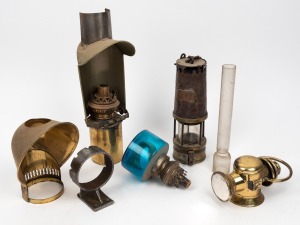 Brass miner's lamp, bike lantern, lamp parts, blue glass kerosene lamp etc., 19th and 20th century, (qty), the largest 36cm high.