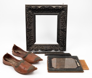 An antique Chinese export ware picture frame, made from solid carved ebony, as is condition, 19th century; together with a pair of vintage Moroccan shoes, (3 items), the frame 36 x 32cm overall.