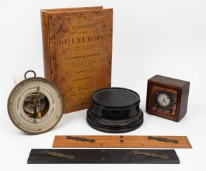 Antique aneroid wall barometer, two antique parallel rules, an antique ebonized timber plinth, a vintage clock housed in a reproduction book box, 19th and 20th century, (6 items), the barometer 16.5cm diameter.